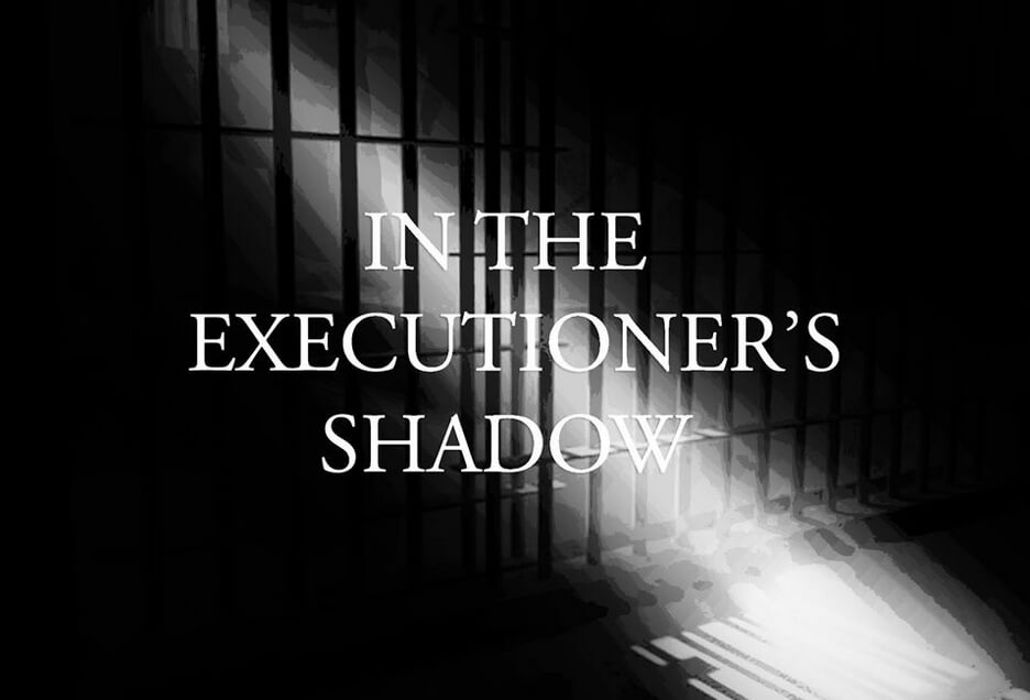 Title text over prison cell, black and white with stream of light shining through the darkness.