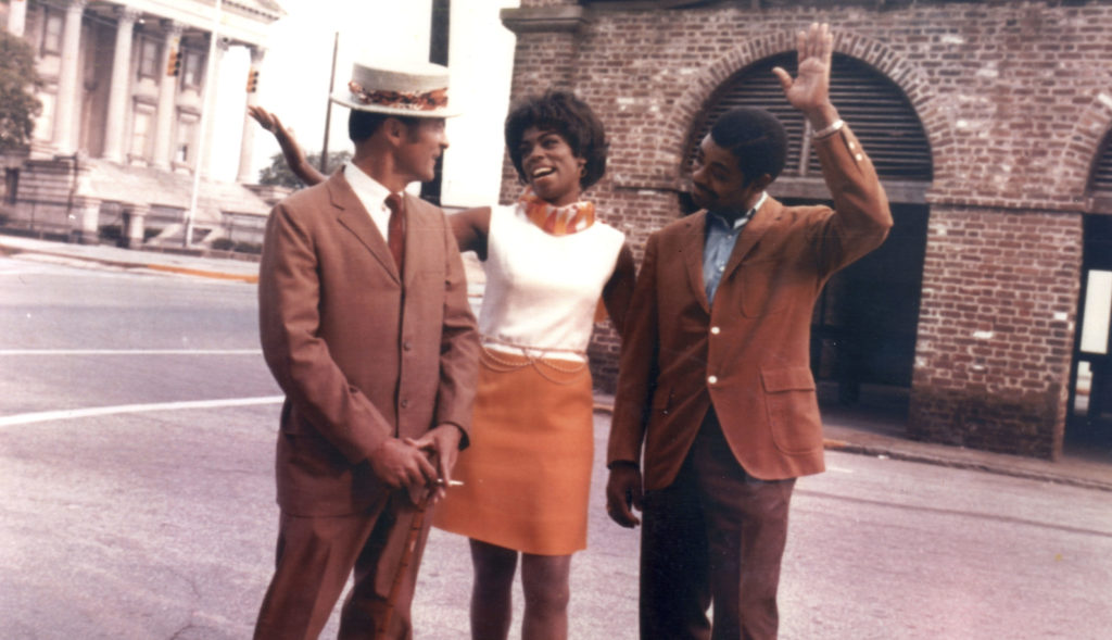 L-R: Claude Pinson (Sportin' Life), Dr. Annette McKenzie Anderson (Bess) and Reuben Wright (Porgy) wave at the Customs House in Charleston, SC. Promotional photo from 1970.