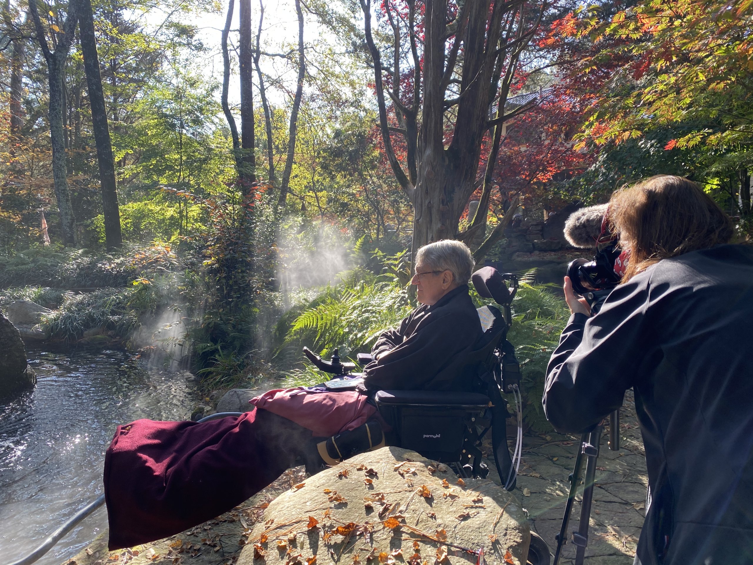 Dan Krebill in his garden with videographer Simone Keith