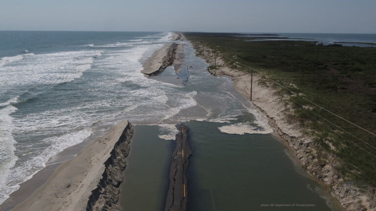 This photograph depicts Atlantic Ocean overwash, flooding and destruction of Highway 12 on Ocracoke Island following Hurricane Dorian in 2019 ― a storm that devastated portions of Ocracoke, Hatteras and Portsmouth islands in less than an hour.